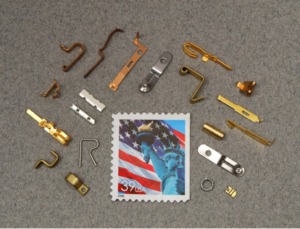 Metal Stamping Materials around Stamp for size reference